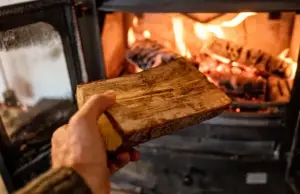 Loading Wood into a homesteader wood stove