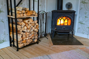 Storing Firewood Indoors Next to a Homesteader Wood Stove