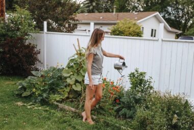 Woman watering home garden Homesteading For Beginners