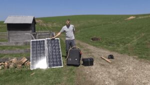 Understanding Solar Generators Guy holding up solar panel on road