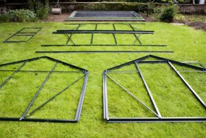 Construct a Greenhouse - Greenhouse parts on ground